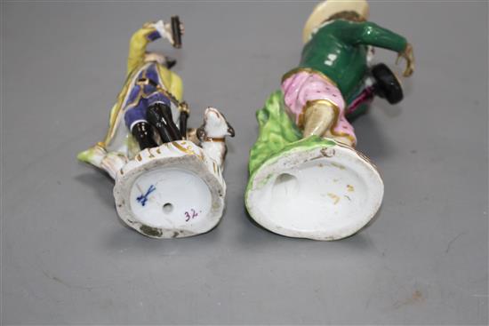 A 19th century Meissen figure of a huntsman and a 19th century English porcelain monkey band figure, 13.5cm and 16cm